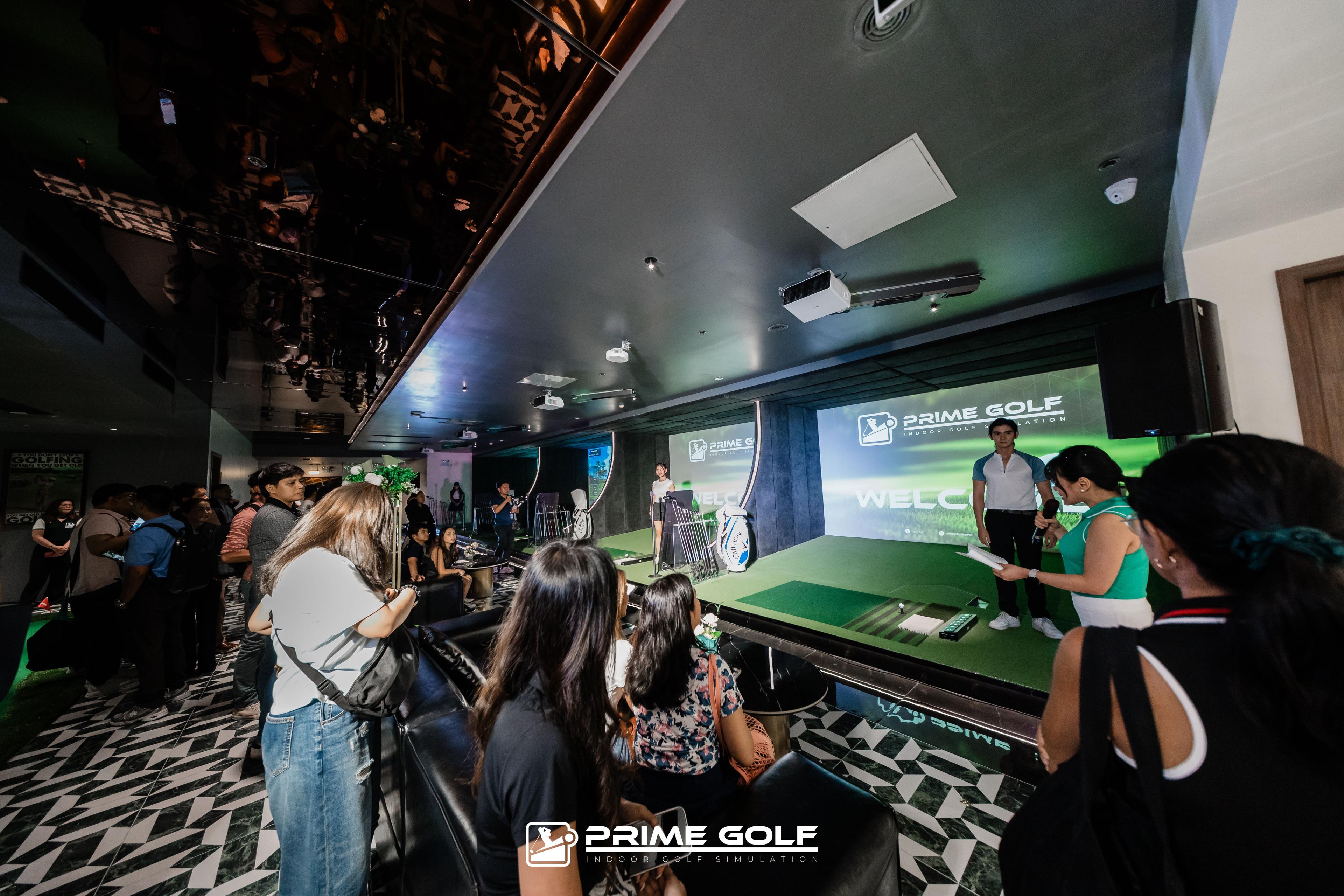 Four open golf simulator hitting bays inside Prime Golf in Manila
