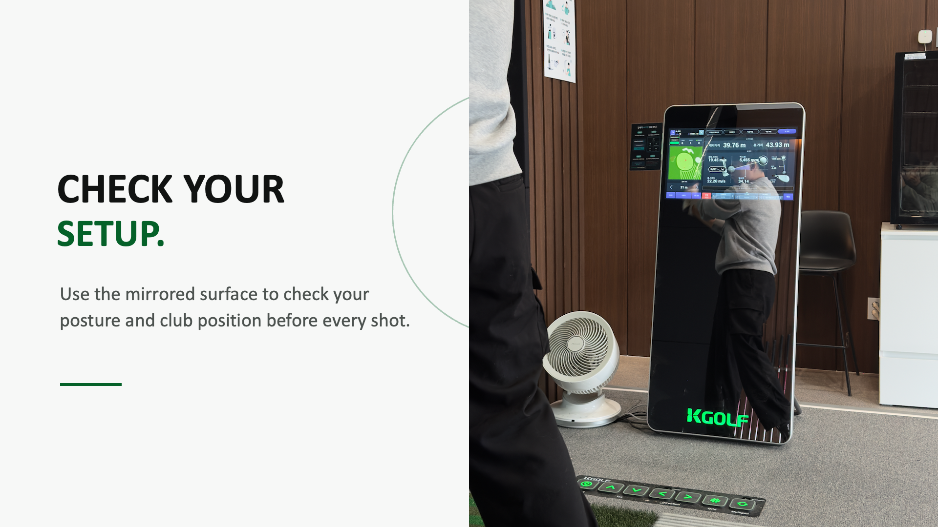 Golfer checking posture and club position using the mirrored surface.